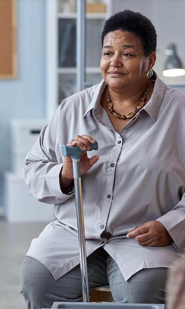 happy woman with a cane