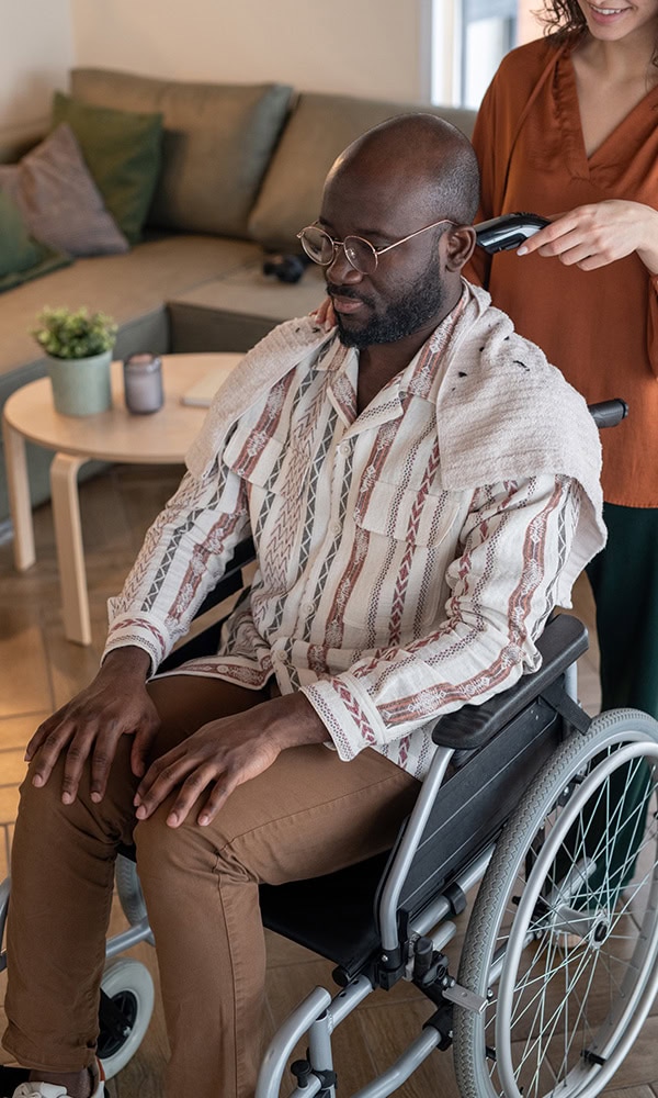 Man in wheelchair with his partner