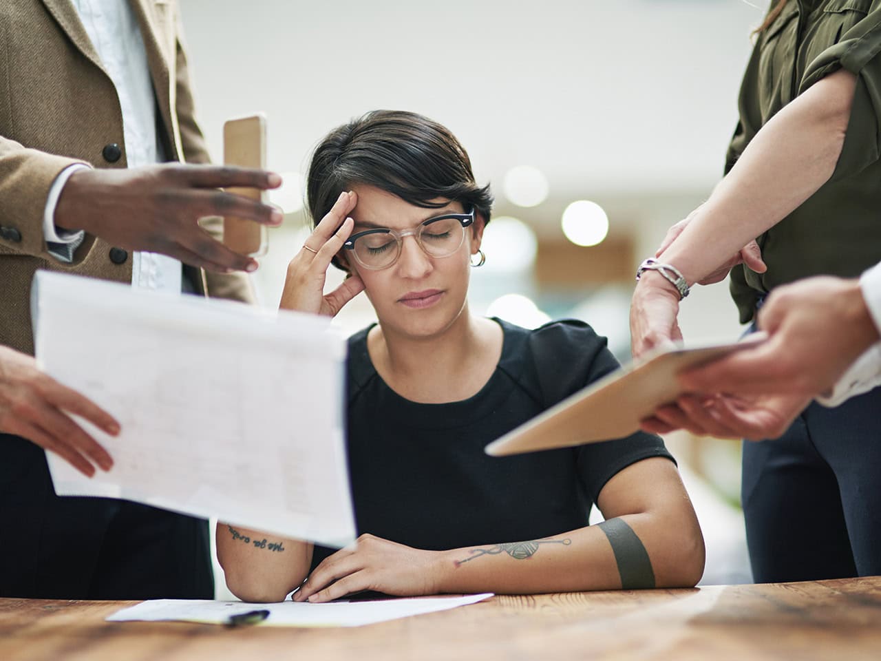 Stressed woman surrounded by tasks