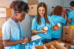 Picture of two female volunteers at a food drive