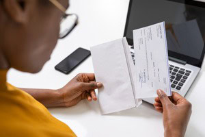 Picture of a woman reading a check