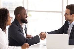 Picture of a couple meeting with an attorney