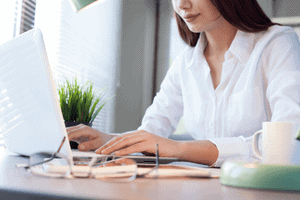 business woman at desk reviewing documents