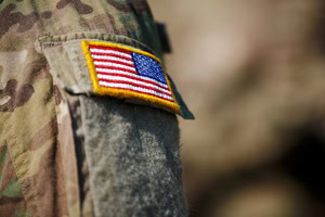 Close up image of the American flag on an army uniform