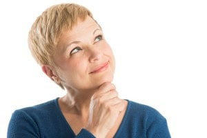 middle aged woman looking pensive