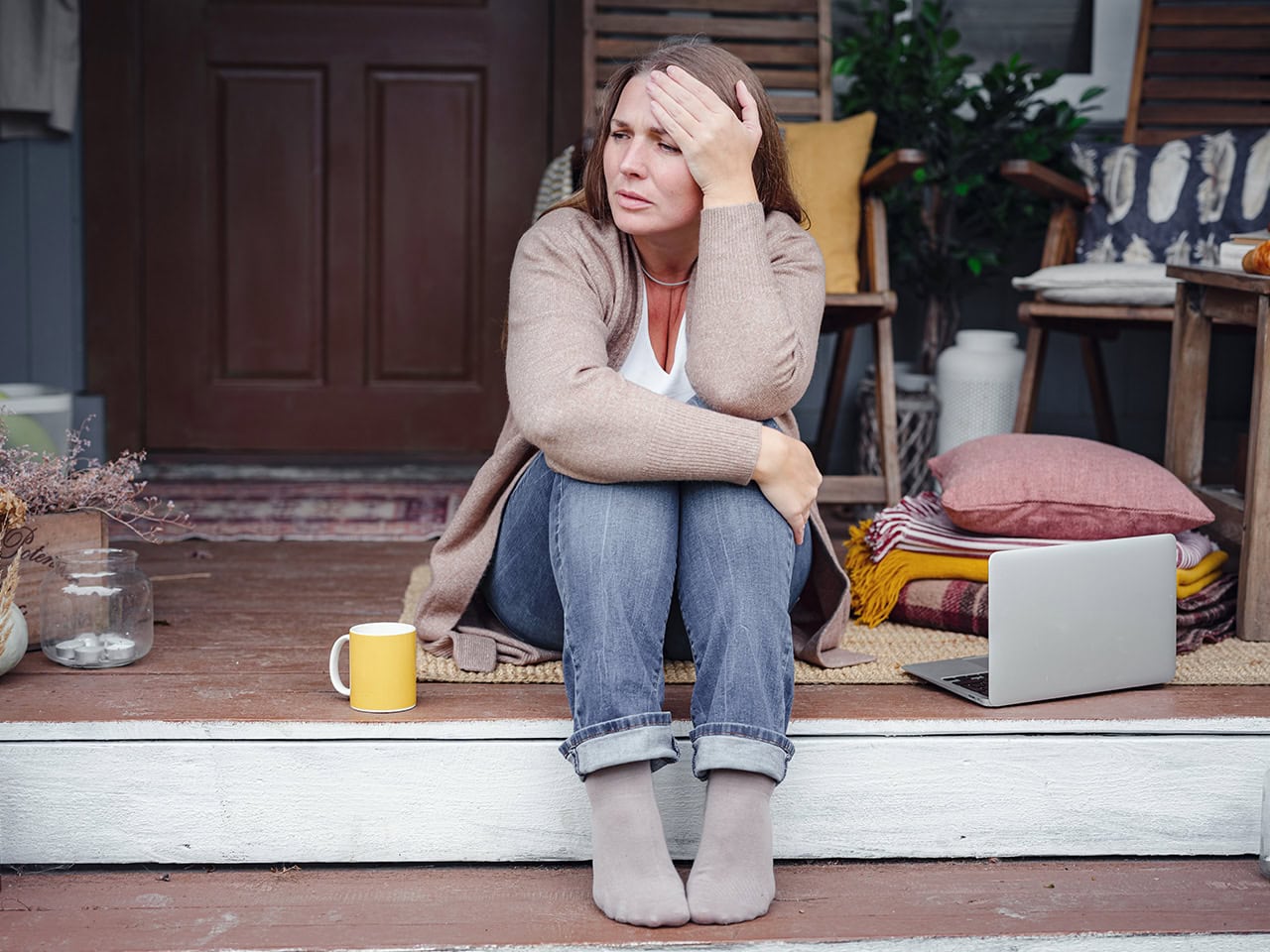 woman sitting on porch steps