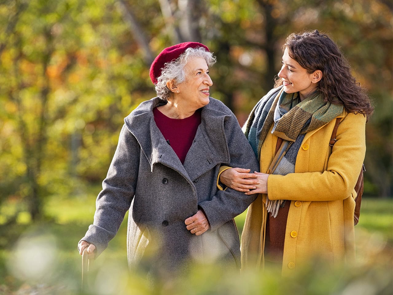 Elderly mother and daughter taking a walk in nature