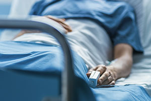 Picture of a person laying down in a hospital bed