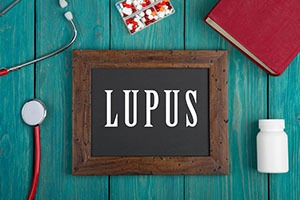 Picture of lupus on a chalkboard, journal, medicine