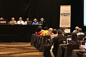 participants of NOSSCR conference sitting and listening to a panel discussion 